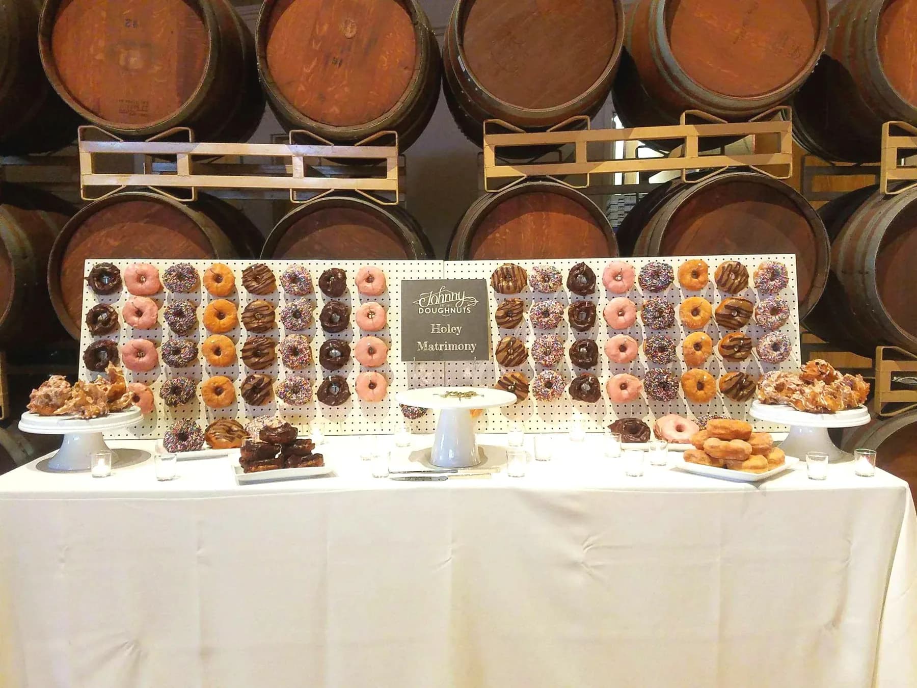 A Johnny Doughnuts wall display at an event